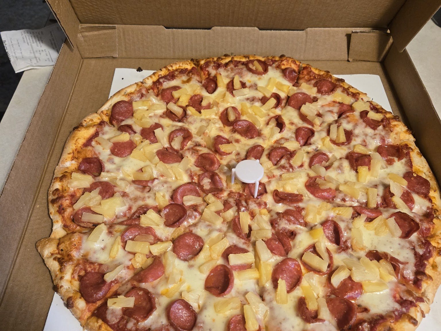 Pepperoni pizza in the box