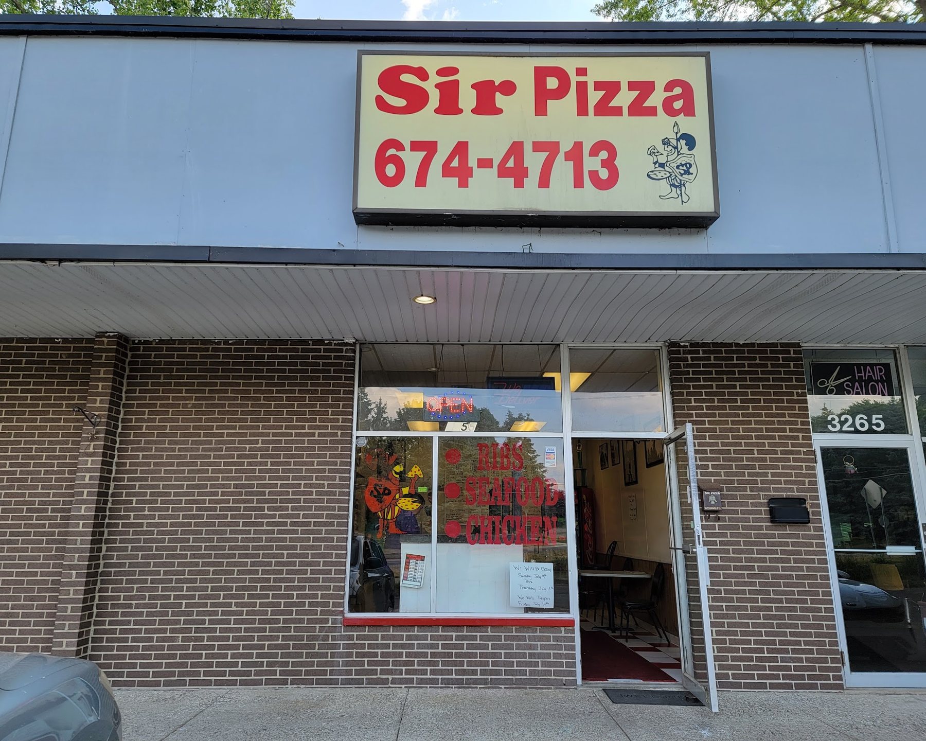 Sir Pizza storefront on Walton Blvd